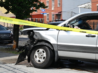 A Honda Pilot is being damaged. One person is dead after a vehicle collision following a police pursuit in Brooklyn, New York, on May 26, 20...