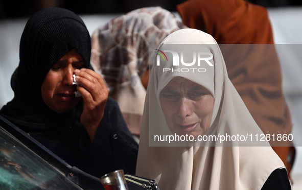 Palestinians are gathering at the site of an Israeli strike on a camp for internally displaced people in Rafah, on May 27, 2024, amid ongoin...