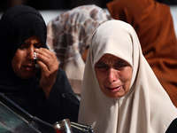 Palestinians are gathering at the site of an Israeli strike on a camp for internally displaced people in Rafah, on May 27, 2024, amid ongoin...