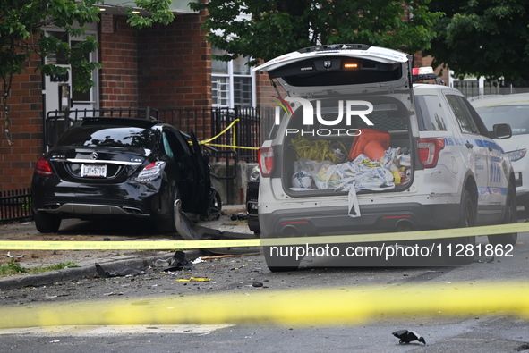 A Mercedes Benz is damaged, and one person is dead after a vehicle collision following a police pursuit in Brooklyn, New York, on May 26, 20...