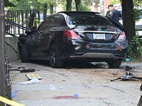 A Mercedes Benz is damaged, and one person is dead after a vehicle collision following a police pursuit in Brooklyn, New York, on May 26, 20...