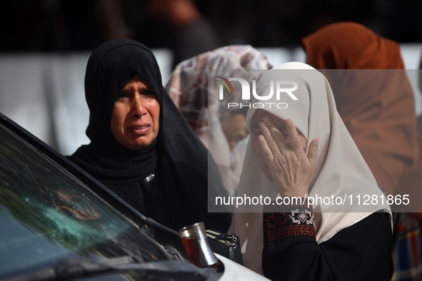 Palestinians are gathering at the site of an Israeli strike on a camp for internally displaced people in Rafah, on May 27, 2024, amid ongoin...