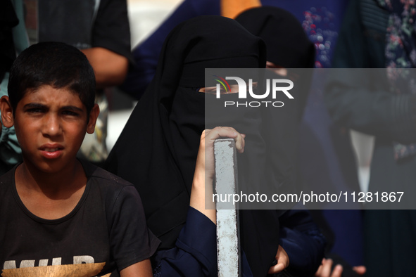 Palestinians are gathering at the site of an Israeli strike on a camp for internally displaced people in Rafah, on May 27, 2024, amid ongoin...