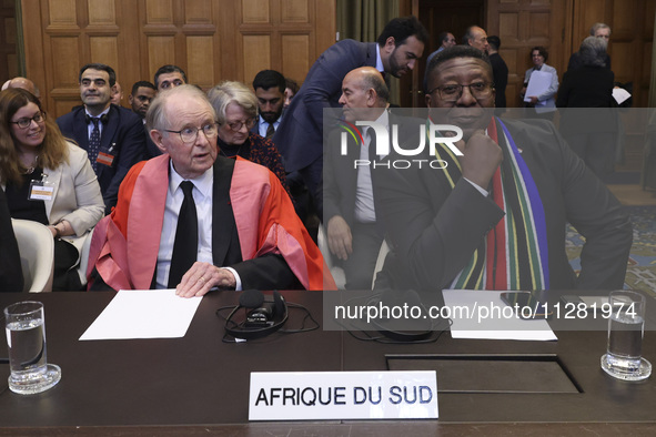 South African Ambassador to the Netherlands Vusimuzi Madonsela and members of the delegation are sitting in the courtroom. The UN top court,...