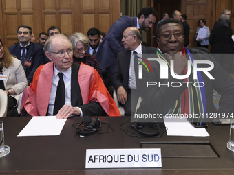 South African Ambassador to the Netherlands Vusimuzi Madonsela and members of the delegation are sitting in the courtroom. The UN top court,...