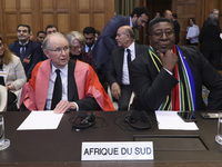 South African Ambassador to the Netherlands Vusimuzi Madonsela and members of the delegation are sitting in the courtroom. The UN top court,...