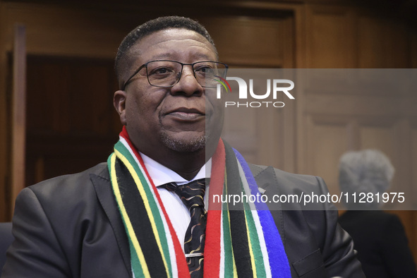 South African Ambassador to the Netherlands Vusimuzi Madonsela and members of the delegation are sitting in the courtroom. The UN top court,...