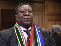 South African Ambassador to the Netherlands Vusimuzi Madonsela and members of the delegation are sitting in the courtroom. The UN top court,...