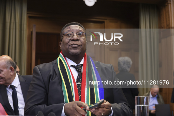 South African Ambassador to the Netherlands Vusimuzi Madonsela and members of the delegation are sitting in the courtroom. The UN top court,...