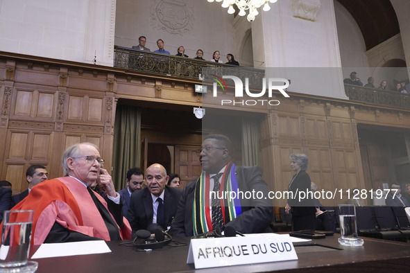 South African Ambassador to the Netherlands Vusimuzi Madonsela and members of the delegation are sitting in the courtroom. The UN top court,...