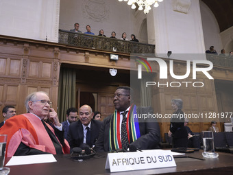 South African Ambassador to the Netherlands Vusimuzi Madonsela and members of the delegation are sitting in the courtroom. The UN top court,...