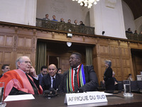 South African Ambassador to the Netherlands Vusimuzi Madonsela and members of the delegation are sitting in the courtroom. The UN top court,...