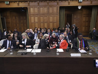 South African Ambassador to the Netherlands Vusimuzi Madonsela and members of the delegation are sitting in the courtroom. The UN top court,...