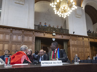 South African Ambassador to the Netherlands Vusimuzi Madonsela and members of the delegation are sitting in the courtroom. The UN top court,...