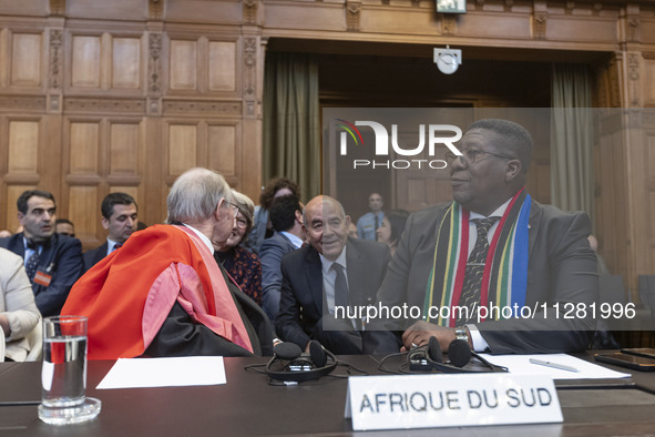 South African Ambassador to the Netherlands Vusimuzi Madonsela and members of the delegation are sitting in the courtroom. The UN top court,...