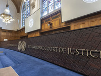 The International Court of Justice logo and inscription are appearing in the courtroom. The UN top court, the International Court of Justice...