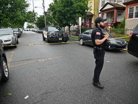 Police are guarding the crime scene. A 26-year-old male victim is suffering gunshot wound injuries in a shooting in Paterson, New Jersey, Un...