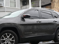 Police are guarding a vehicle with several bullet holes and towing it from the crime scene. A 26-year-old male victim is suffering gunshot w...