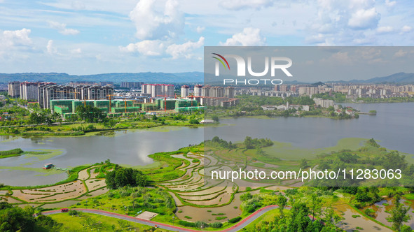 The Shuangguihu Lake National Wetland Park is being seen under the blue sky and white clouds in Chongqing, China, on May 27, 2024. Recently,...