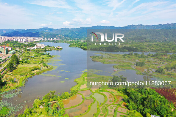 The Shuangguihu Lake National Wetland Park is being seen under the blue sky and white clouds in Chongqing, China, on May 27, 2024. Recently,...