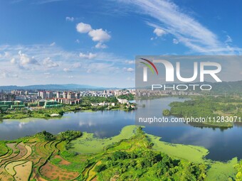 The Shuangguihu Lake National Wetland Park is being seen under the blue sky and white clouds in Chongqing, China, on May 27, 2024. Recently,...