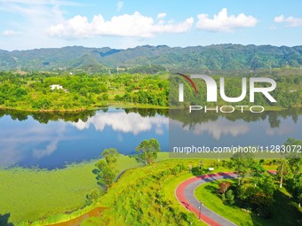 The Shuangguihu Lake National Wetland Park is being seen under the blue sky and white clouds in Chongqing, China, on May 27, 2024. Recently,...