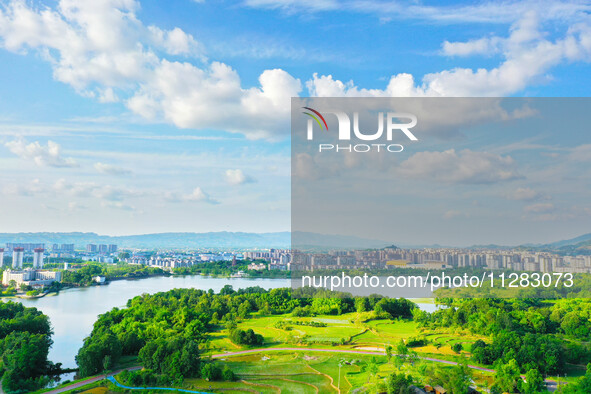 The Shuangguihu Lake National Wetland Park is being seen under the blue sky and white clouds in Chongqing, China, on May 27, 2024. Recently,...