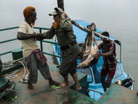 An injured pregnant deer is being transported by forest department officials as it is floated at the western outskirts of Sunderban amidst C...