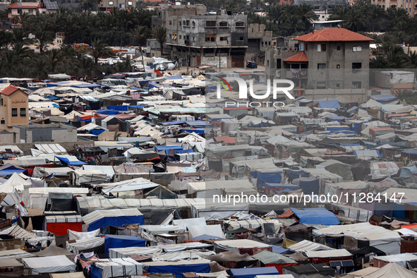 A general view is showing tents housing internally displaced Palestinians crowding the beach and the Mediterranean shoreline in Deir el-Bala...