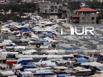 A general view is showing tents housing internally displaced Palestinians crowding the beach and the Mediterranean shoreline in Deir el-Bala...