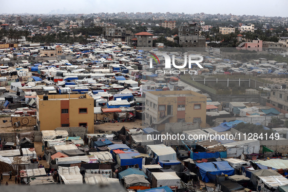 A general view is showing tents housing internally displaced Palestinians crowding the beach and the Mediterranean shoreline in Deir el-Bala...