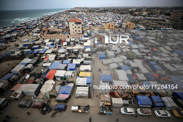 A general view is showing tents housing internally displaced Palestinians crowding the beach and the Mediterranean shoreline in Deir el-Bala...