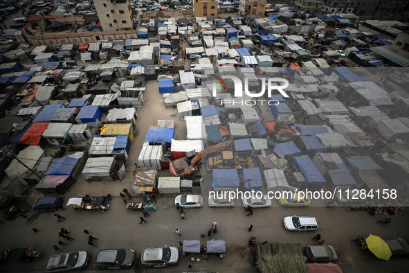 A general view is showing tents housing internally displaced Palestinians crowding the beach and the Mediterranean shoreline in Deir el-Bala...