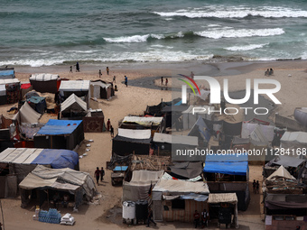 A general view is showing tents housing internally displaced Palestinians crowding the beach and the Mediterranean shoreline in Deir el-Bala...