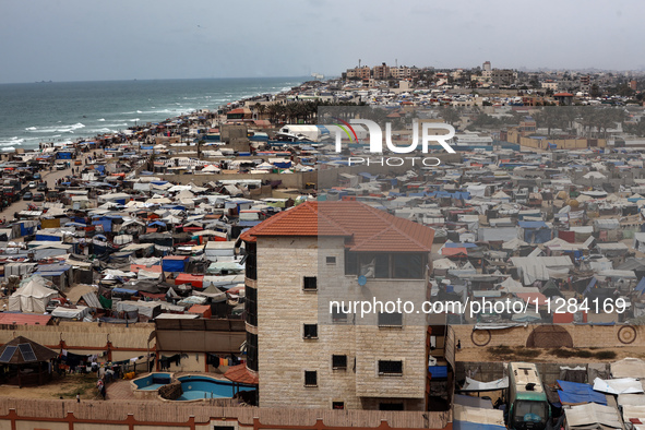 A general view is showing tents housing internally displaced Palestinians crowding the beach and the Mediterranean shoreline in Deir el-Bala...