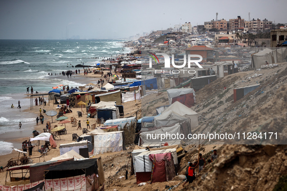 A general view is showing tents housing internally displaced Palestinians crowding the beach and the Mediterranean shoreline in Deir el-Bala...