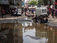 Displaced Palestinians are walking near sewage water in Deir el-Balah in the central Gaza Strip on May 28, 2024, amid the ongoing conflict b...