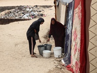 Displaced Palestinians are being seen among the tents in Deir el-Balah in the central Gaza Strip on May 28, 2024, amid the ongoing conflict...