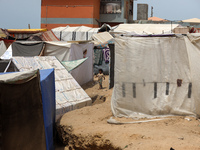 Displaced Palestinians are being seen among the tents in Deir el-Balah in the central Gaza Strip on May 28, 2024, amid the ongoing conflict...