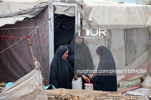 Displaced Palestinians are being seen among the tents in Deir el-Balah in the central Gaza Strip on May 28, 2024, amid the ongoing conflict...