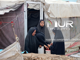 Displaced Palestinians are being seen among the tents in Deir el-Balah in the central Gaza Strip on May 28, 2024, amid the ongoing conflict...