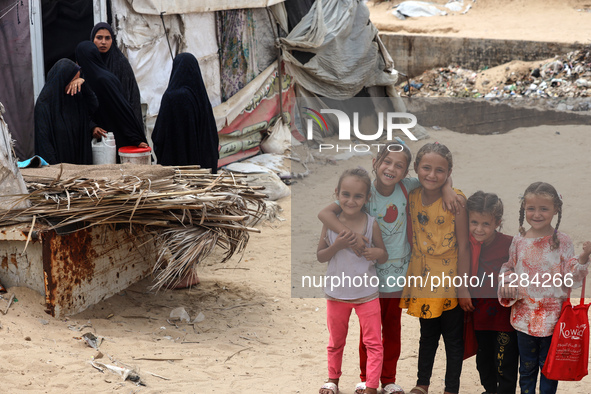 Displaced Palestinians are being seen among the tents in Deir el-Balah in the central Gaza Strip on May 28, 2024, amid the ongoing conflict...