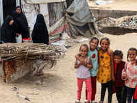 Displaced Palestinians are being seen among the tents in Deir el-Balah in the central Gaza Strip on May 28, 2024, amid the ongoing conflict...