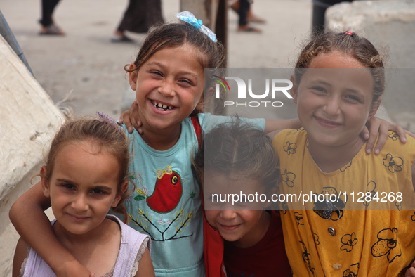 Displaced Palestinians are being seen among the tents in Deir el-Balah in the central Gaza Strip on May 28, 2024, amid the ongoing conflict...