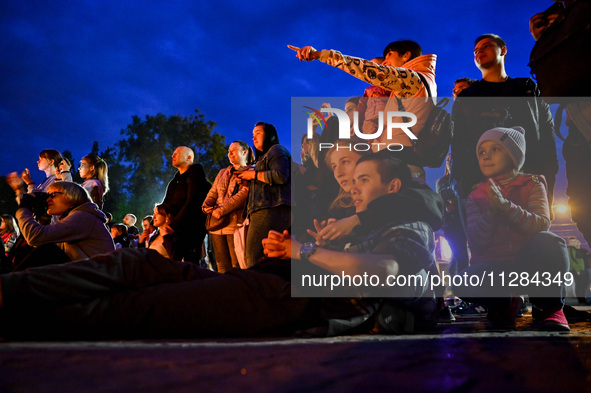 Visitors are watching fire artists perform on Maiakovskyi Square to raise funds for the purchase of FPV drones for the 3rd Separate Assault...