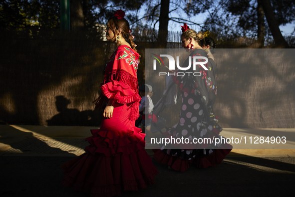 Women are dressing in typical flamenco dresses during the festivities of the Corpus Christi in Granada, Spain, on May 28, 2024. The Corpus C...