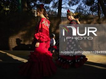 Women are dressing in typical flamenco dresses during the festivities of the Corpus Christi in Granada, Spain, on May 28, 2024. The Corpus C...