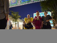 Women are dressing in typical flamenco dresses and walking during the festivities of the Corpus Christi in Granada, Spain, on May 28, 2024....