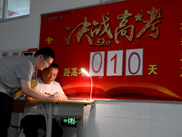 A senior three student is asking her teacher a question at the door of her classroom at Fengfeng No 1 Middle School in Handan, Hebei provinc...