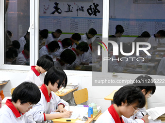 Senior three students, who are about to take the National College entrance examination, are studying by themselves at night at Fengfeng No 1...